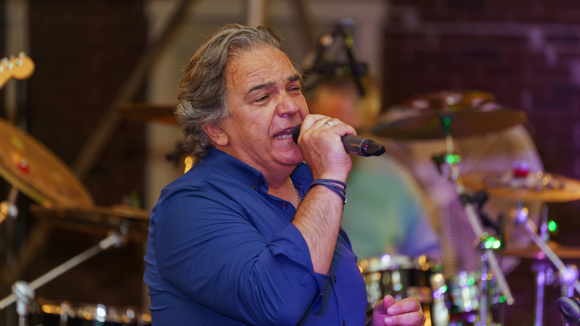 Damien Stefanidis singing lead vocals with Orfeas Band