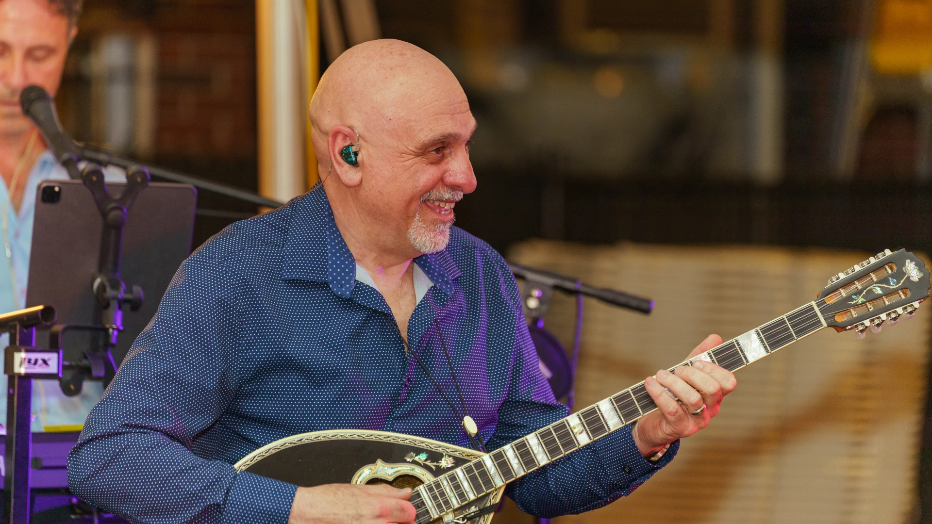 Anthony Pentikis on bouzouki with Orfeas Band during a live set